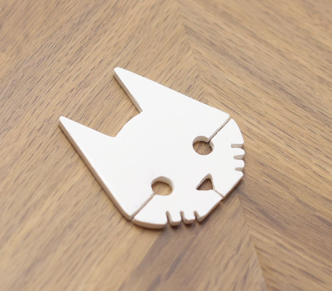 Stray hand made and painted logo badge/magnet.